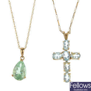 A selection of four gem-set pendants.