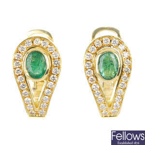 A pair of emerald and diamond earrings. 