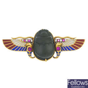 An 18ct gold Egyptian Revival gem-set winged scarab brooch.
