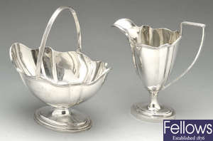 An Edwardian silver sugar bowl and cream jug.