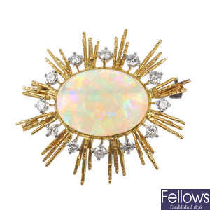An opal and diamond sunburst brooch.