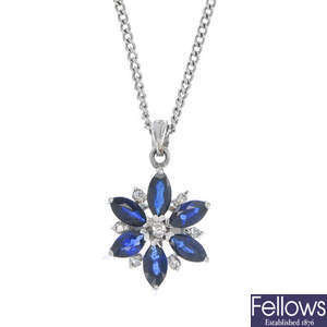 A sapphire and diamond floral cluster pendant.