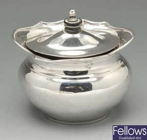 A small Edwardian silver lidded bowl & a 1930's silver caster.