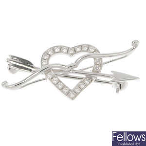 An 18ct gold diamond bow and arrow heart brooch, by Mappin & Webb.