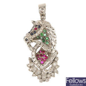 A diamond and gem-set horse pendant.