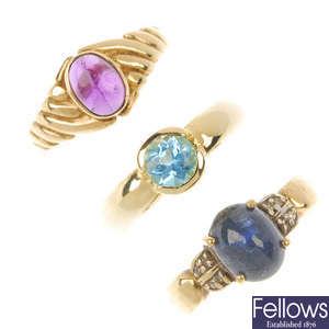 A selection of three gem-set single-stone rings.