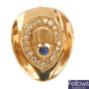A sapphire and diamond novelty pendant.
