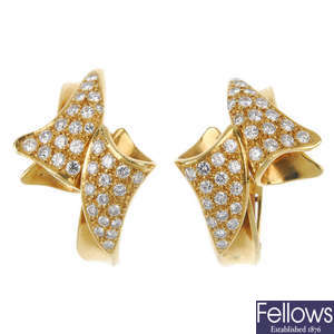 A pair of diamond ear clips.