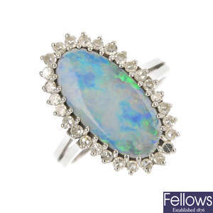 An opal triplet and diamond cluster ring.