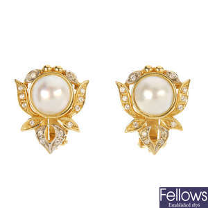 A pair of mabe pearl and cubic cubic zirconia earrings. 