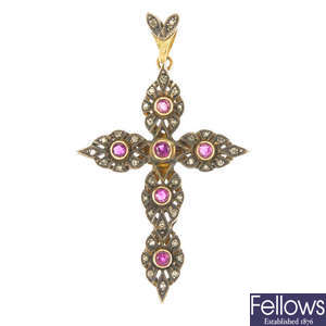 A synthetic ruby and diamond cross pendant. 