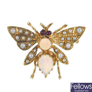 A 9ct gold gem-set butterfly brooch and a gem-set ring. 