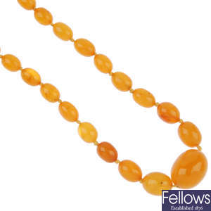 A natural opaque amber bead single-strand necklace.