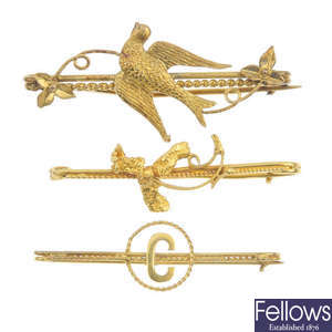 A collection of four bar brooches. 