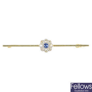 An early 20th century 15ct gold and platinum sapphire and diamond floral brooch.