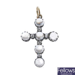 A late 19th century silver and 12ct gold moonstone and diamond cross pendant.