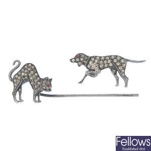 A paste cat and dog jabot pin.
