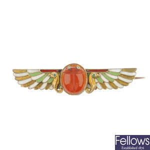An early 20th century Egyptian revival enamel and gem-set winged scarab brooch.