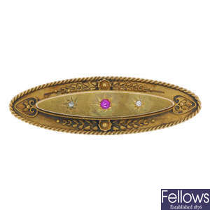 An early 20th century 15ct gold ruby and diamond panel brooch