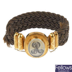 A mid 19th century 18ct gold memorial woven hair bracelet.