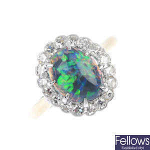 A mid 20th century black opal and diamond cluster ring.