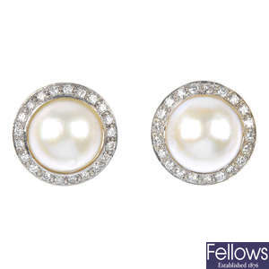 BOODLES & DUNTHORNE - a pair of 14ct gold mabe pearl and diamond ear clips.
