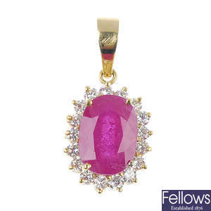 A glass-filled ruby and diamond cluster pendant.