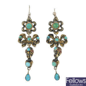 A pair of early 20th century turquoise and enamel blackamoor ear pendants.