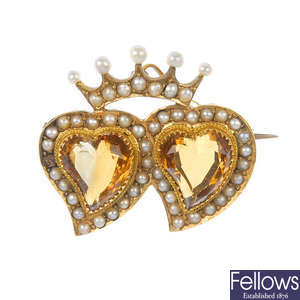 An early 20th century 15ct gold citrine and seed pearl heart brooch