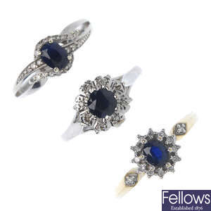A selection of three gold diamond and sapphire rings. 