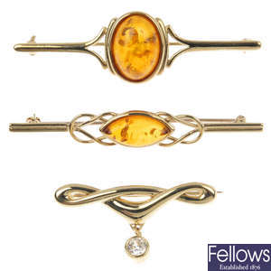 A selection of 9ct gold gem-set brooches.