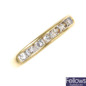 A diamond seven-stone band ring.