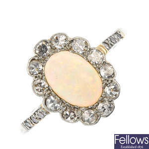 A platinum and 18ct gold opal and diamond ring.