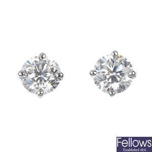 A pair of brilliant-cut diamond single-stone ear studs.