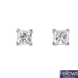A pair of square-shape diamond single-stone ear studs. 