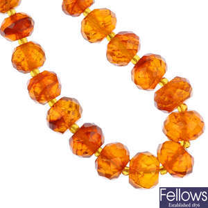 A natural Baltic amber faceted bead necklace and a modified Baltic amber bead necklace.