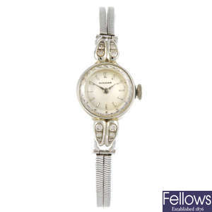 HUGUENIN - a lady's bracelet watch together with another lady's Huguenin wrist watch. 