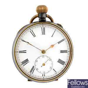 An open face pocket watch with two silver pocket watches.