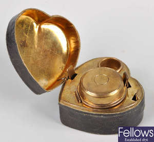 A heart shaped inkwell.