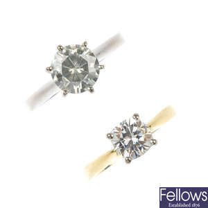 Two 18ct gold synthetic moissanite single-stone rings.