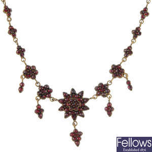 Four items of garnet and red paste jewellery.