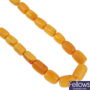 A natural amber bead necklace. Marked bead is pressed reconstructed amber.