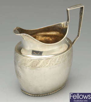 A George III silver cream jug & Edwardian example.