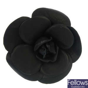 CHANEL - a black flower brooch.