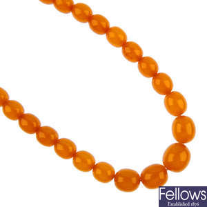 A pressed amber bead necklace.