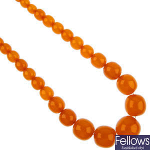 A pressed amber bead necklace.