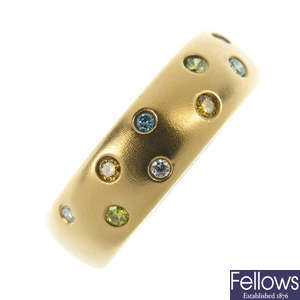 An 18ct gold colour-treated diamond band ring.