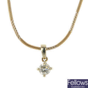 An 18ct gold diamond single-stone pendant with 9ct gold chain.
