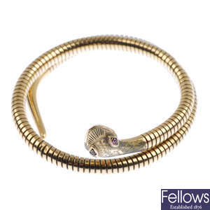 A 9ct gold snake bangle. 