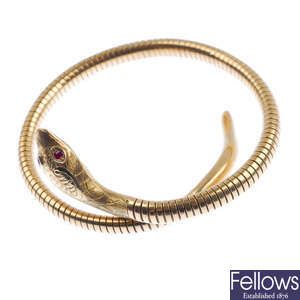 A mid 20th century 9ct gold snake bangle.